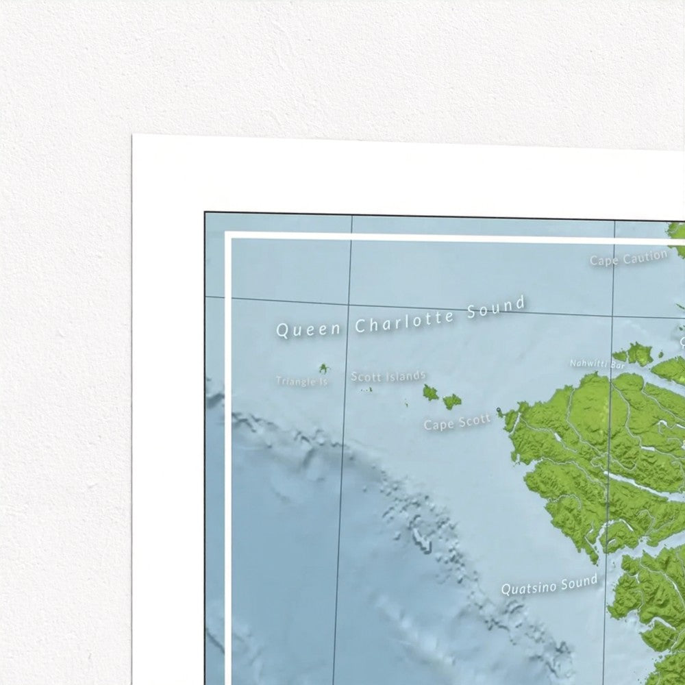 A small, zoomed in corner of a printed map poster for wall art of the north west corner of Vancouver Island. Coloured with various shades of green and blue representing land and water features. Labeled with ocean features.