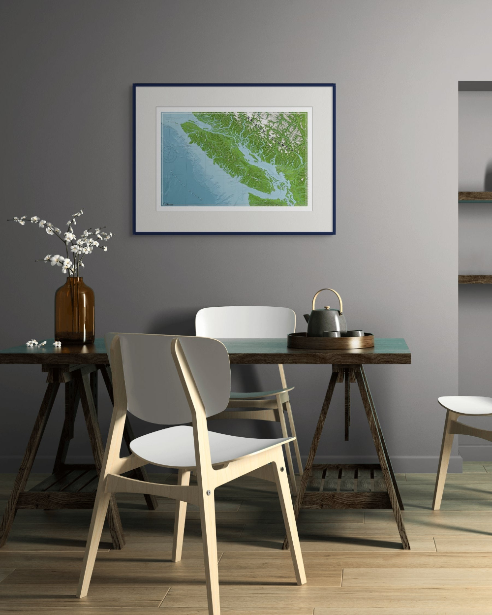 Dining room with wooden table and chairs, framed map poster artwork of Vancouver Island on the wall.