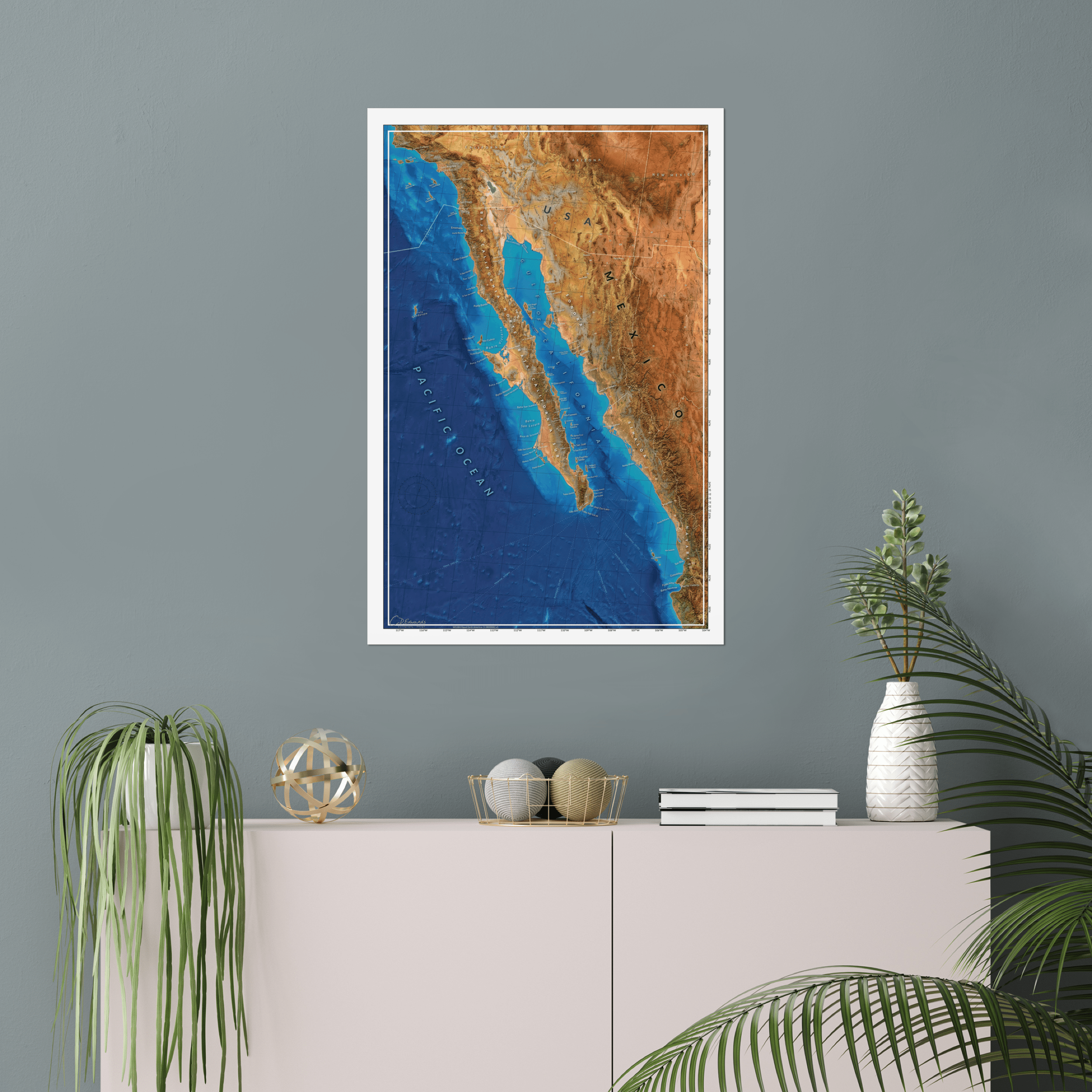 Baja map print above bookshelf on wall, illustrating complete Gulf bathymetry and sailing route options.