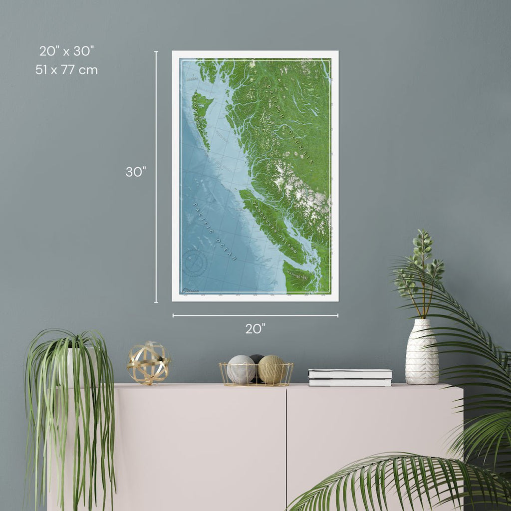 Printed poster map of British Columbia, hung on a gray wall, showing the 20x30" dimensions