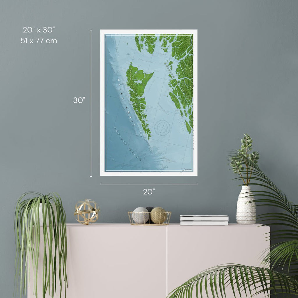 Printed wall map of Haida Gwaii, on a gray wall, showing the 20x30 inch dimensions