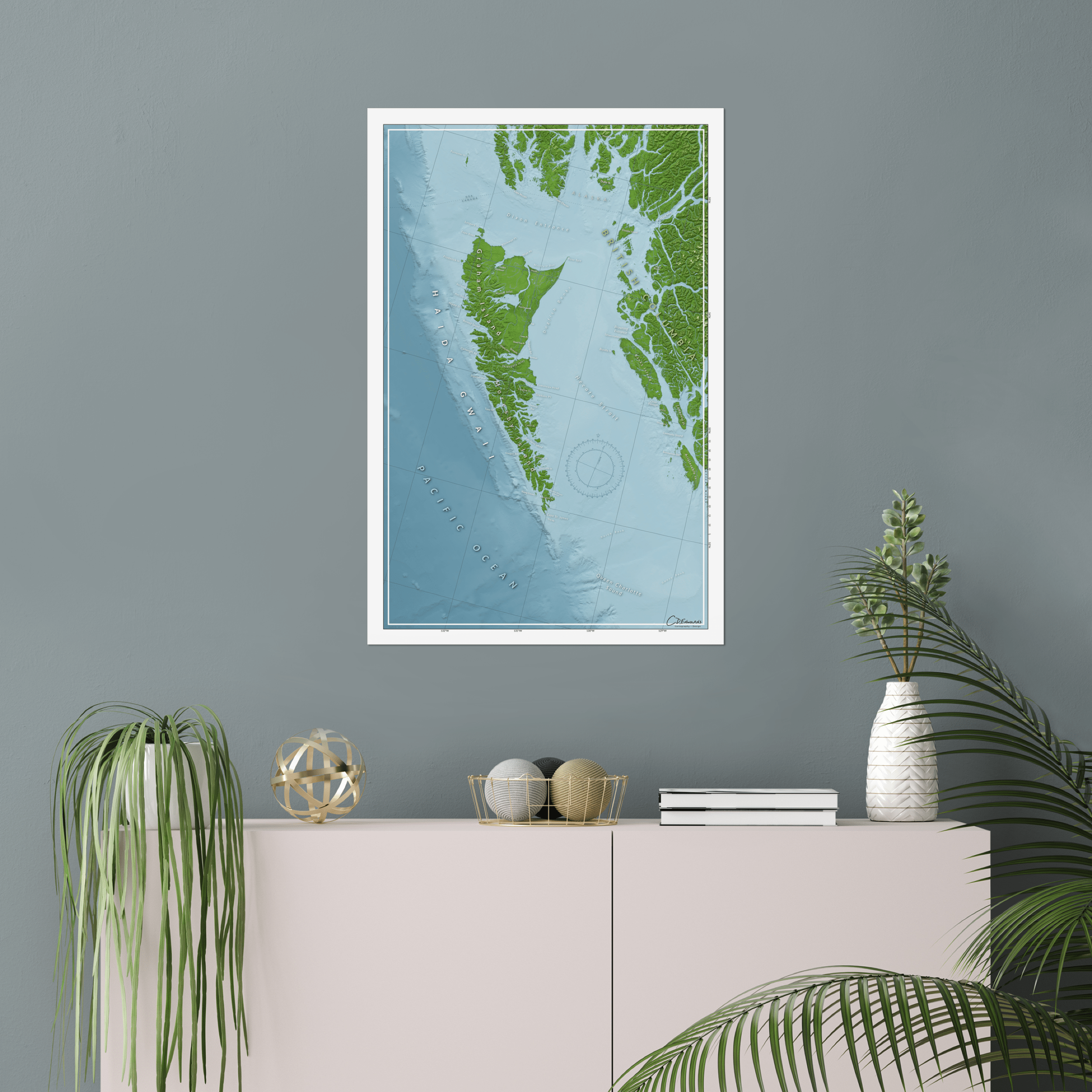 Haida Gwaii map print above bookshelf on wall, showcasing remote islands and marine exploration vibes.​
